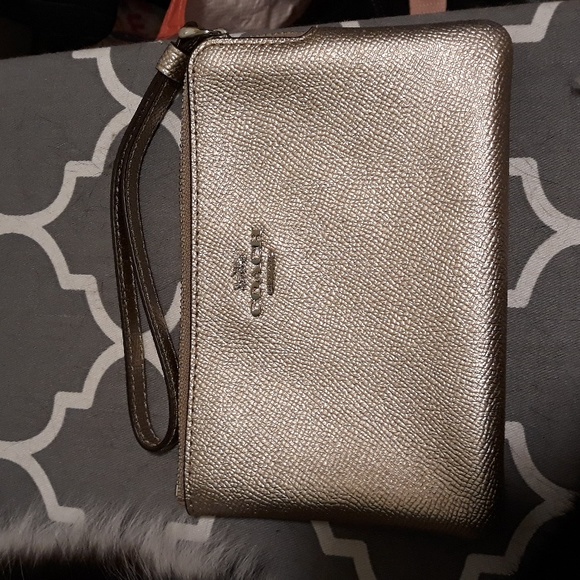 Coach Handbags - Coach metallic wristlet leather gold